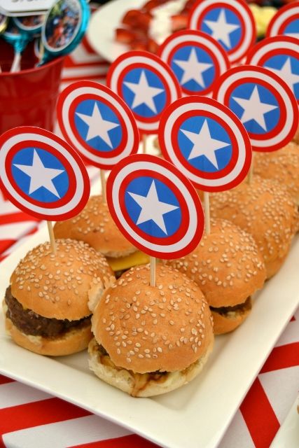 some hamburgers with captain america decorations on them