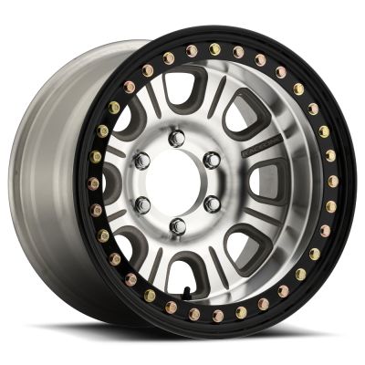 an aluminum wheel with black spokes and gold rivets on the rim, against a white background