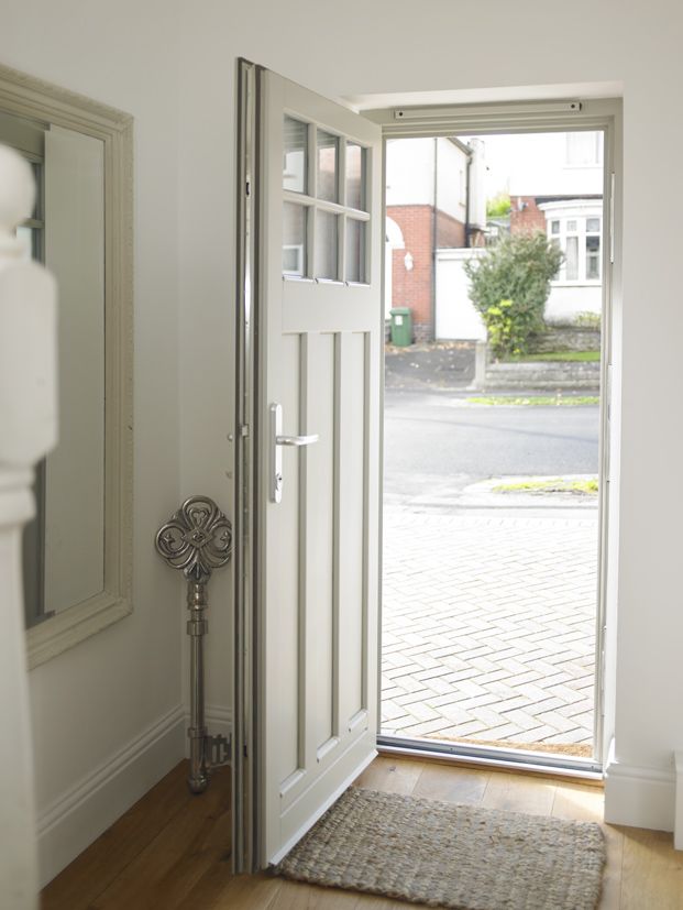 an open door leading into a room with wooden floors