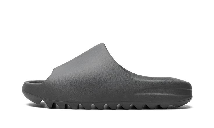 The adidas Yeezy Slide ”Slate Grey” is a monochromatic dark grey colorway of the popular slip-on sandal.  The “Slate Grey” edition gives the comfortable and casual slip-on sandal a versatile look.  The design features a lightweight, one-piece EVA foam build in Slate Grey.  Ridges on the outsole ensure traction on slippery surfaces.  Release date: August 22, 2023