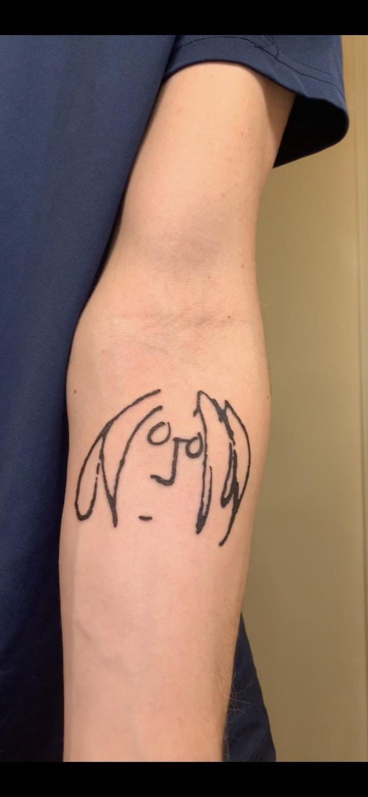 a person with a tattoo on their arm