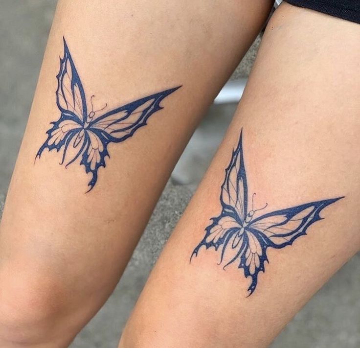 two blue butterflies on both legs