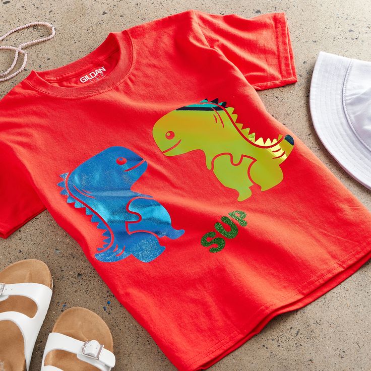 Buy the Gildan® Short Sleeve Youth T-Shirt at Michaels. Here’s a fun idea to keep the kids busy…let them design their very own t-shirt! Combine the softness of 100% cotton and their own one-of-a-kind creation and this will definitely be their favorite tee. Here’s a fun idea to keep the kids busy…let them design their very own t-shirt! Combine the softness of this shirt and their own one-of-a-kind creativity and this will definitely be their favorite tee. Details: Available in multiple colors and Red Letter Print Tops For Playtime, Red Letter Print Top For Playtime, Playful Red T-shirt For Summer, Red Character Print T-shirt For Playtime, Red Short Sleeve T-shirt For Family, Red Graphic Print T-shirt For Playtime, Fun Red T-shirt For Playtime, Red Graphic Print Casual T-shirt, Playful Red Summer T-shirt