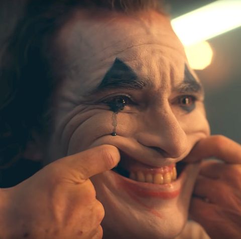 a man with his face painted to look like the joker