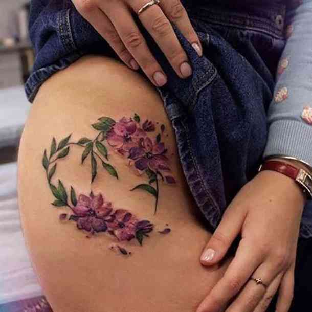 a woman's stomach with flowers on it