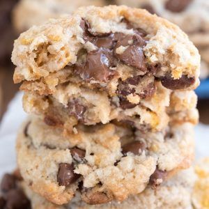 three chocolate chip cookies stacked on top of each other