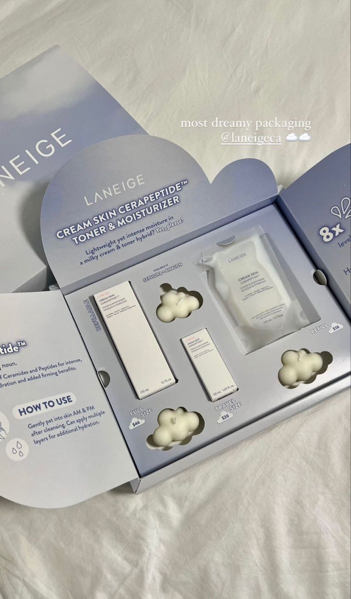 an opened box containing three items for the skin care product range on a white sheet