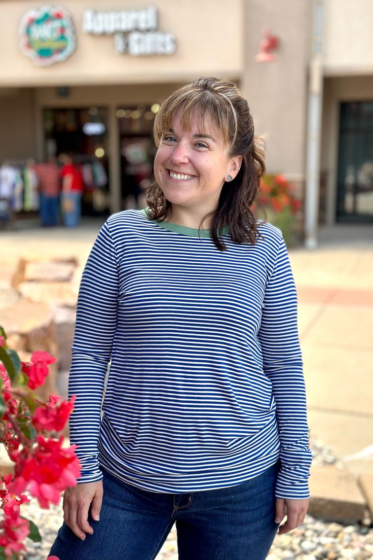 Sawyer is a fan-favorite long sleeved tee! The small stripes with contrasting neckline band add visual interest to elevate this basic. Very soft fabric and true-to-size fit. Features royal blue and white stripes with green trim on the neckline. 95% Rayon / 5% Spandex TTS Fit. Soft Fabric, Soft Fabrics, White Stripe, Royal Blue, Long Sleeve Tees, Blue And White, Stripes, Trim, Spandex