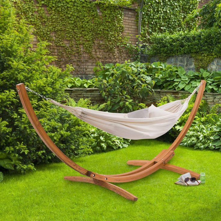 a hammock is set up in the grass