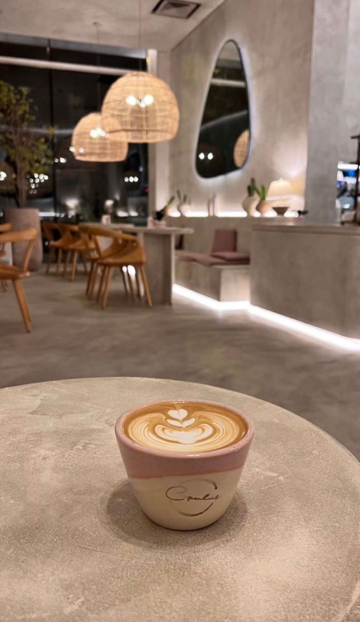 a cappuccino sitting on top of a table