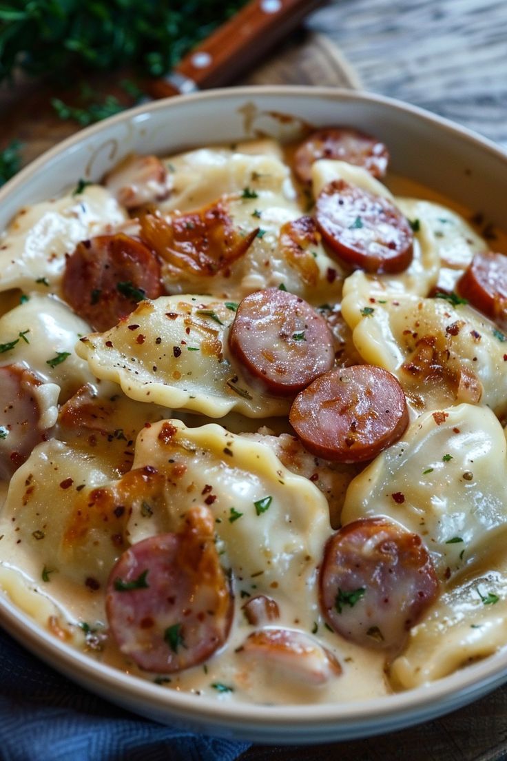 a bowl filled with pasta covered in cheese and pepperoni toppings on top of a wooden table