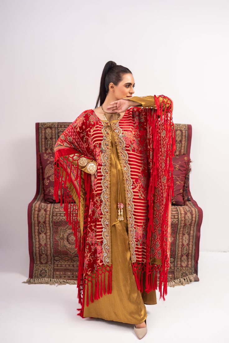 Discover luxury and elegance with our Red and Yellow Coat Shalwar Kameez. Made from plush materials, this front open poncho boasts intricate kundan work lace and resham tassels on each corner. The inner turmeric colored georgette silk shirt and pants add a touch of sophistication. Feel confident and stylish in this timeless piece. 3-Piece Suit Open Poncho, Kundan Work, Yellow Coat, Shalwar Kameez, 3 Piece Suits, Red And Yellow, Shirt And Pants, Silk Shirt, Wedding Men