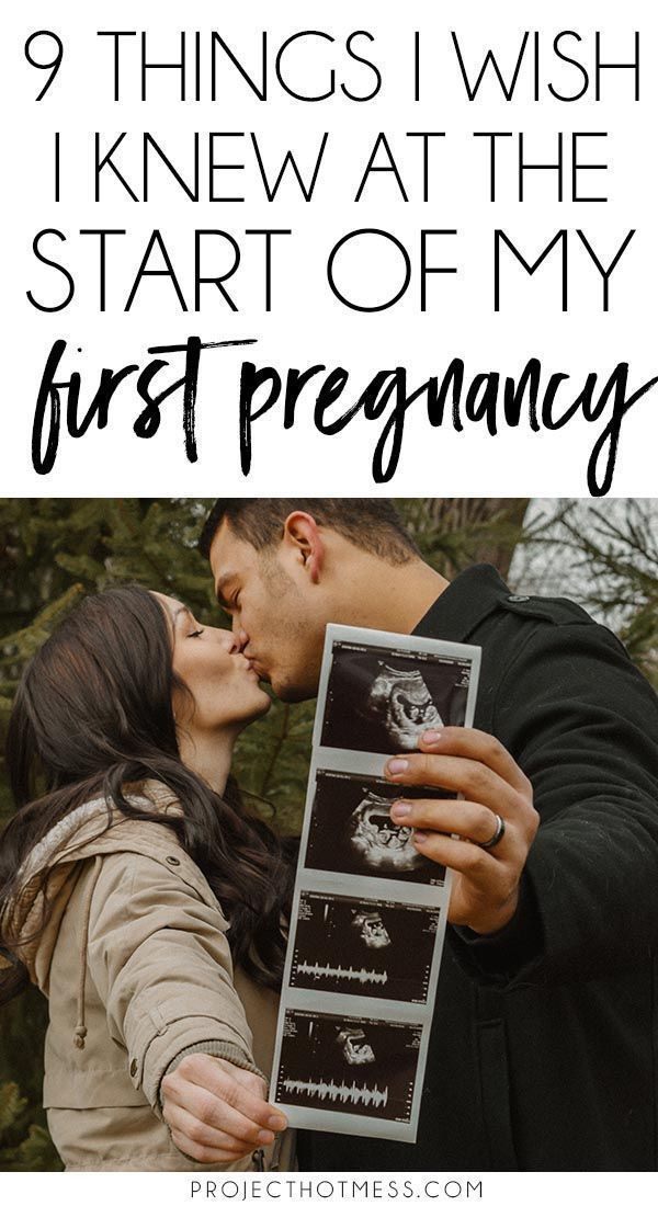 a man and woman kissing each other with the text 9 things i wish i knew at the start of my first pregnancy