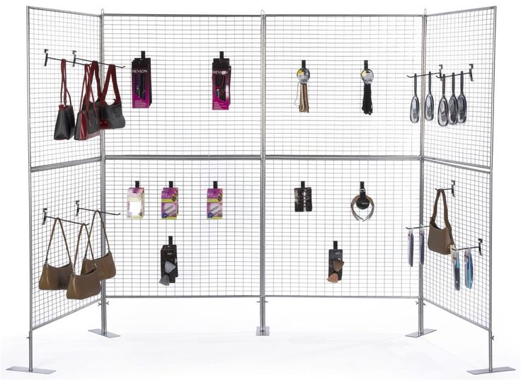 a display with multiple purses hanging on the wall