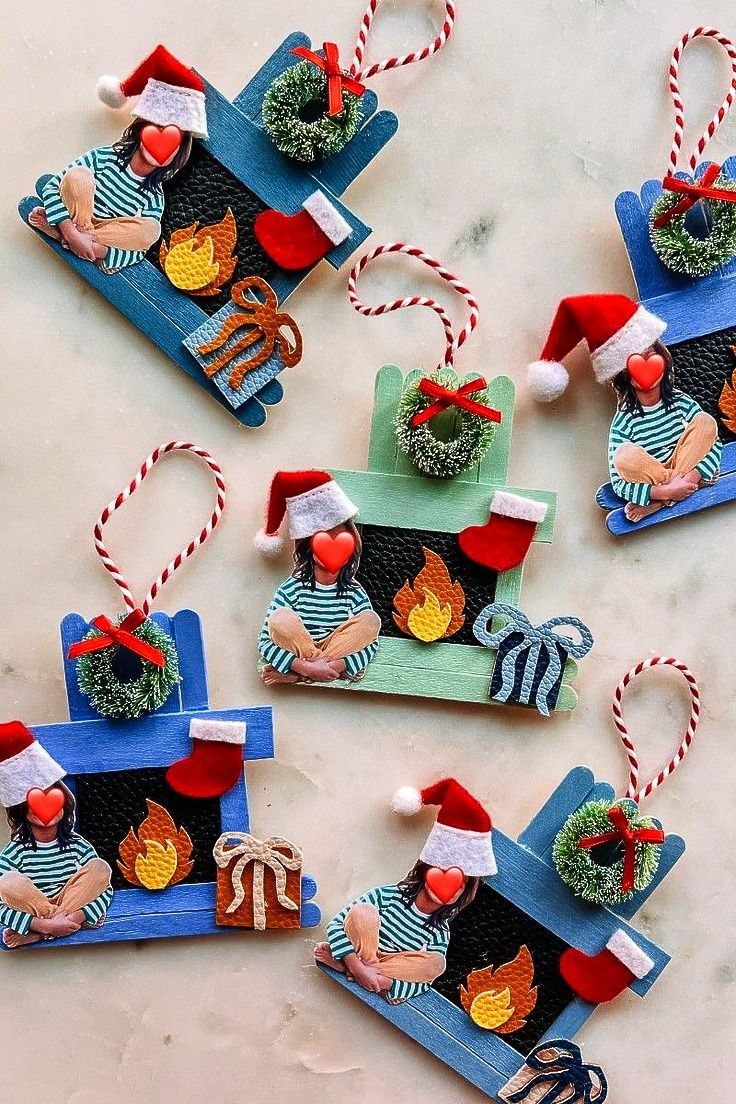 christmas ornaments made out of cardboard are sitting on a table