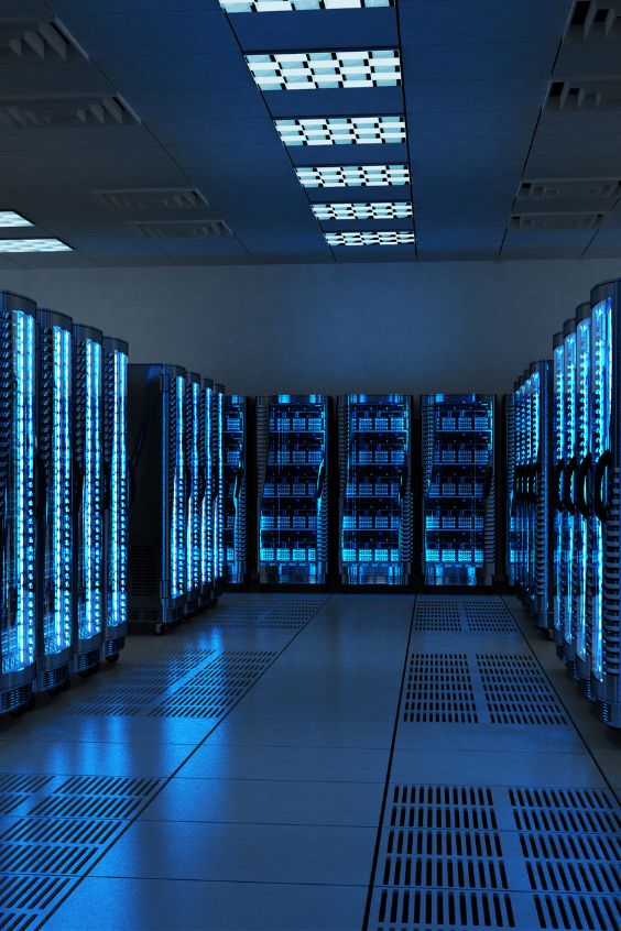 rows of servers in a data center with blue lights on the ceiling and flooring