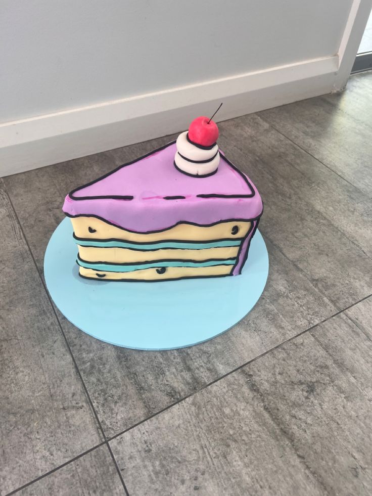 a piece of cake sitting on top of a blue plate next to a white door