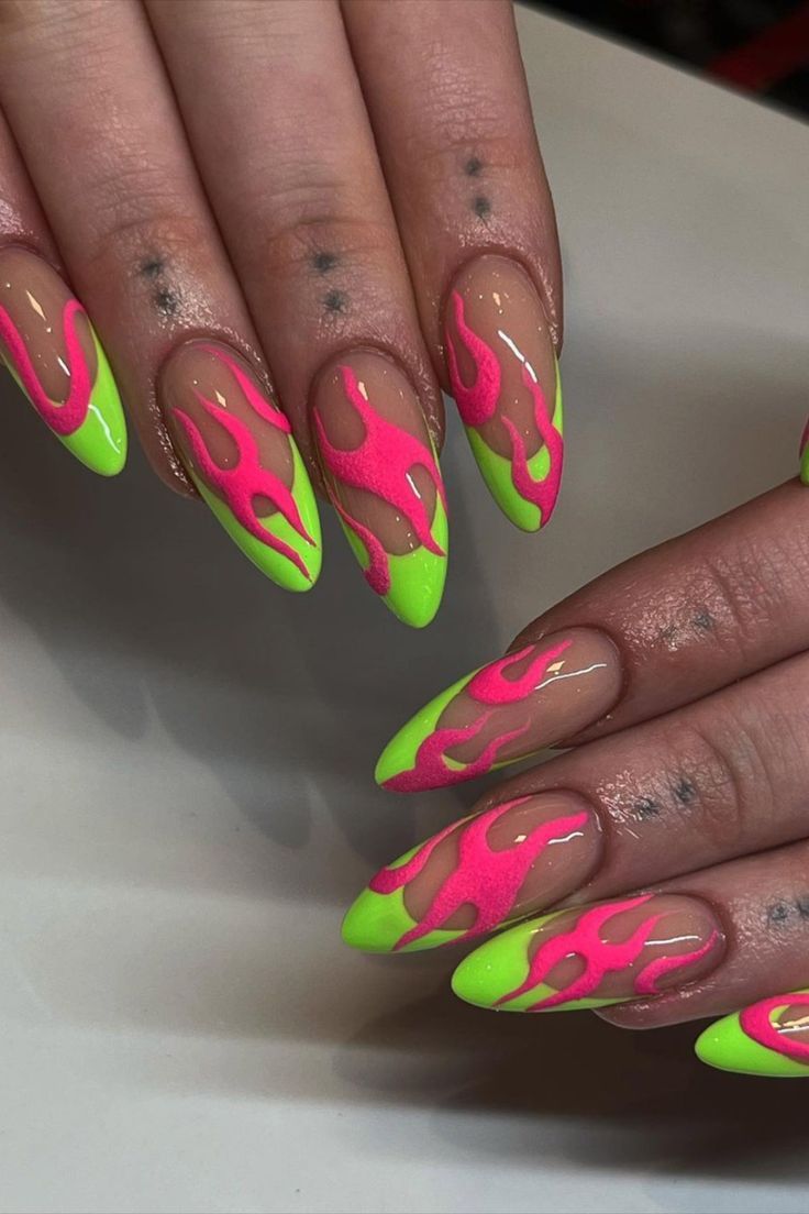 These almond-shaped nails by @giangnail.ie feature a unique combination of green French tips and striking pink flame nail art, creating a bold and stylish statement. Get inspired with 25 bold and vibrant neon nail ideas on Nailustrous to make your manicure pop this summer! Pink And Green Nail Designs, Neon Nail Ideas, Tattoo Nails, Flame Nail Art, Pink Tip Nails, Neon Nail Designs, Neon Green Nails, Green Nail Art, Punk Nails