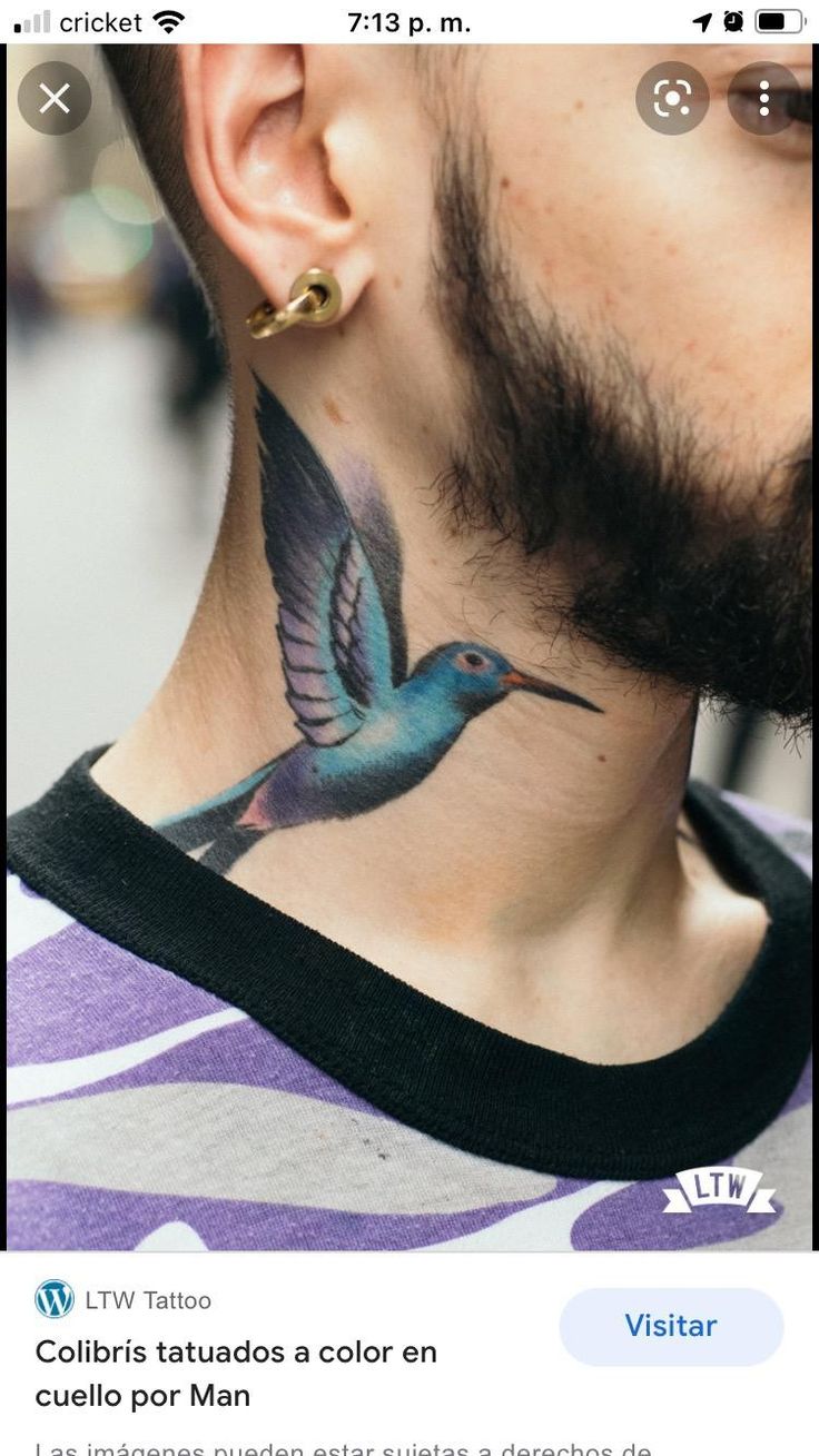 a man with a bird tattoo on his neck