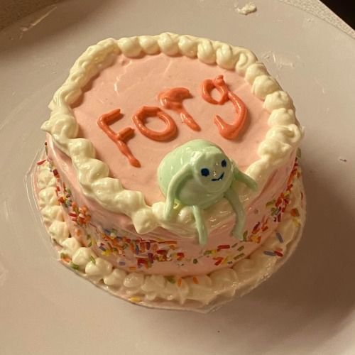 a birthday cake with frosting and sprinkles on it