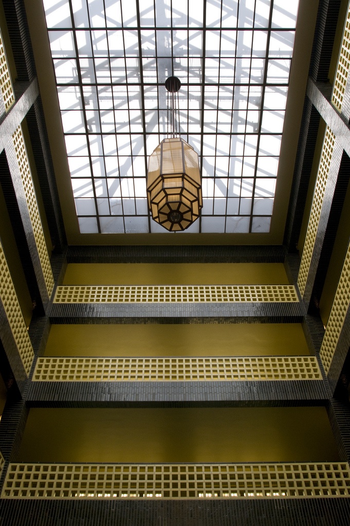 an overhead view of the ceiling in a building with metal grates and a light fixture