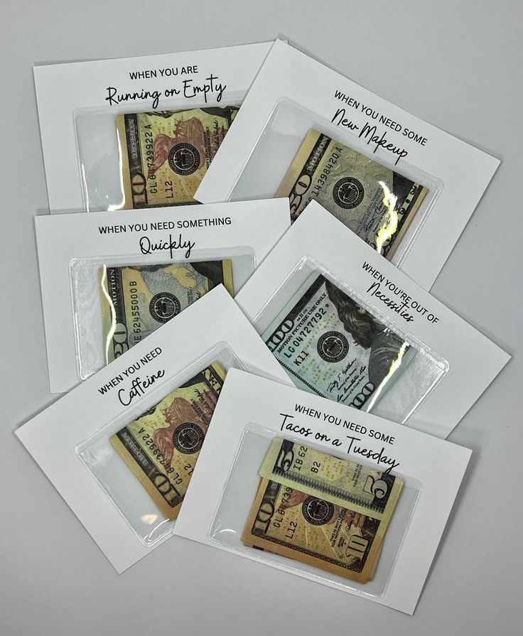 five envelopes with money inside and writing on them