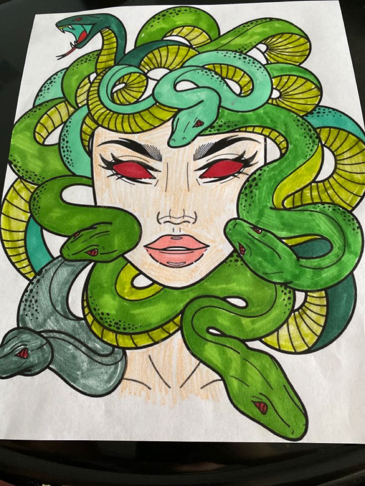 a drawing of a woman with green snakes around her head and eyes, on a piece of paper