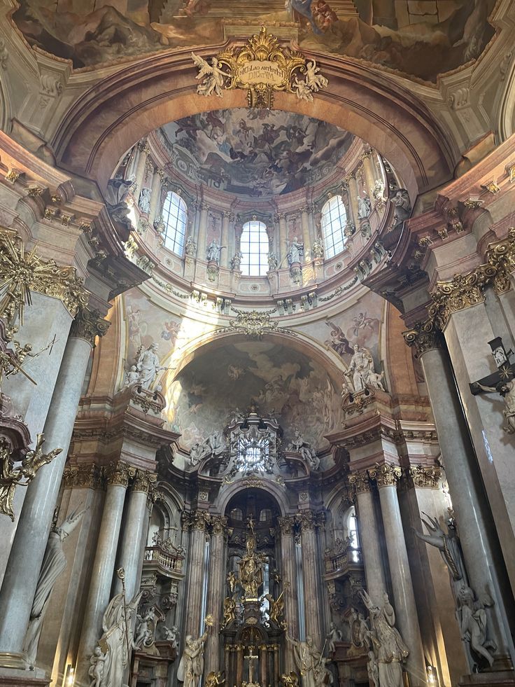 the interior of an old church with many statues