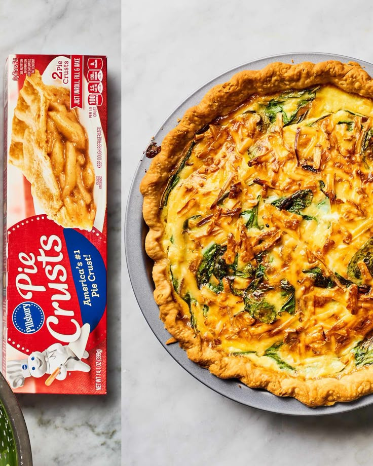 an image of a quiche with cheese and spinach on it next to a box of cheesy fries