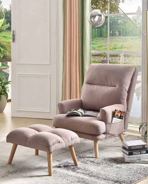 a living room scene with focus on the chair and ottoman