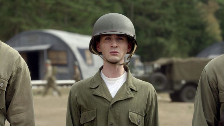 a man wearing a helmet standing next to another man in uniform with an inscription that says, that's what i thought