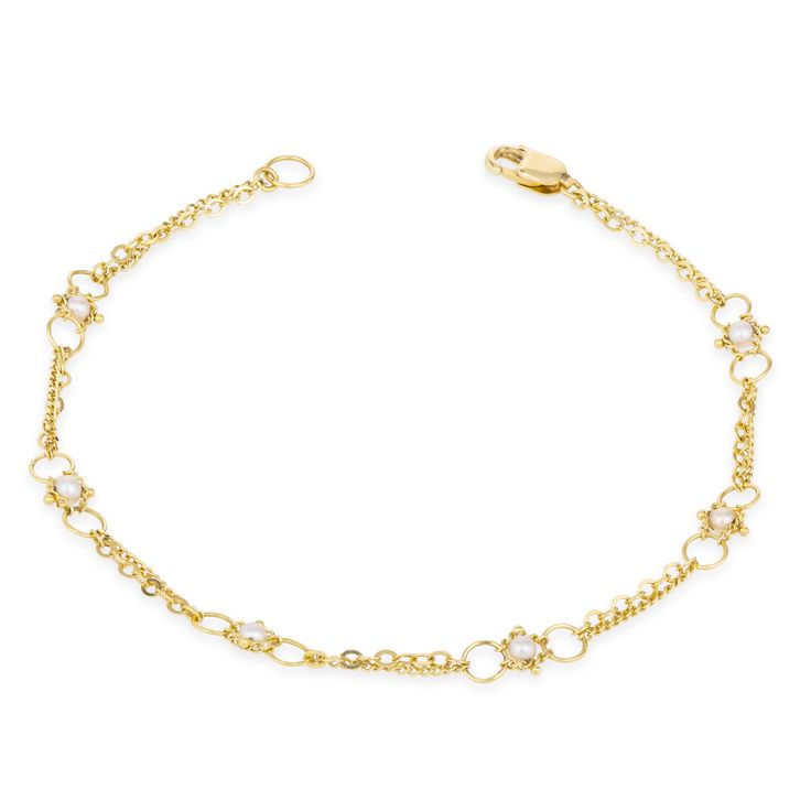 Dainty 18K yellow gold chain encircles the wrist like strands of sunlight, punctuated at intervals by the luster of Pearl beads. The links of the meticulously hand-woven chains form tiny, intricate patterns that draw the eye and create a gorgeously textured overall effect. Delicate as a whisper, this bracelet is as easy to wear as it is beautiful. Technical Details Metal: 18k yellow goldGemstone: PearlLength: 7" Handmade in New YorkStyle # B-1615-P Formal Fine Jewelry Delicate Chain Bracelet, Elegant Yellow Gold Link Diamond Bracelet, Delicate Yellow Gold Chain Link Bracelet, Gold Plated Yellow Gold Chain Bracelet, Elegant Link Jewelry With Spring Ring Clasp, Yellow Gold Plated Chain Bracelet With Spring Ring Clasp, Delicate Yellow Gold Diamond Bracelet, Elegant Gold-plated Link Bracelet, Delicate Yellow Gold Oval Link Chain Bracelet