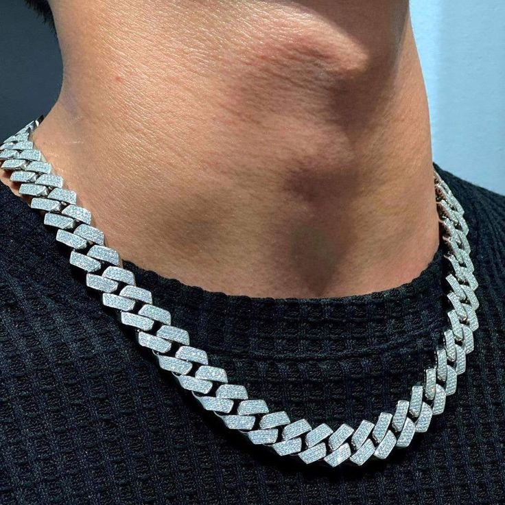 Cuban Link Chain Necklace is the epitome of refined power, a dazzling addition that speaks to the connoisseur of standout accessories. Each meticulously handcrafted link forms a cascade of strength and shine around the neck, creating an aura of undeniable presence.Product Highlights: Precise Length for Versatility: At 18 inches, this necklace effortlessly graces the collarbone, suited for a range of necklines and outfits, making it an indispensable piece for various occasions, from everyday wear to special events. Sturdy Elegance of Cuban Links: The renowned Cuban link pattern offers a robust yet sophisticated structure that holds up against the passage of time, while also serving as a fashion-forward emblem of taste. Handcrafted Excellence: Artisans dedicate hours to forge each necklace, Fine Jewelry Cuban Link With Adjustable Chain, Fine Jewelry With Adjustable Cuban Link Chain, Diamond Cuban Link Necklace With Adjustable Chain, Chunky Chain Link Cubic Zirconia Jewelry, Elegant Silver Cuban Link Necklace With Chunky Chain, Luxury Silver Link Chain Necklace, Formal Diamond White Necklaces With Chain, Crystal Cuban Link Jewelry With Adjustable Chain, Cuban Link Cubic Zirconia Chain Necklace