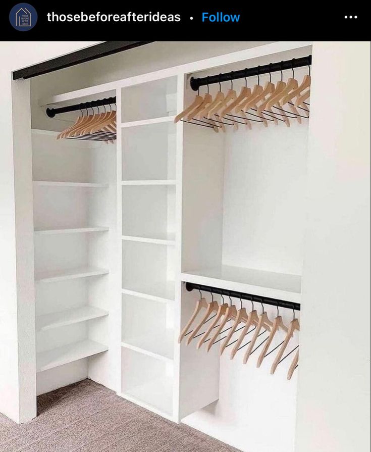 an empty closet with white shelves and wooden clothes hangers on the wall, along with carpeted flooring