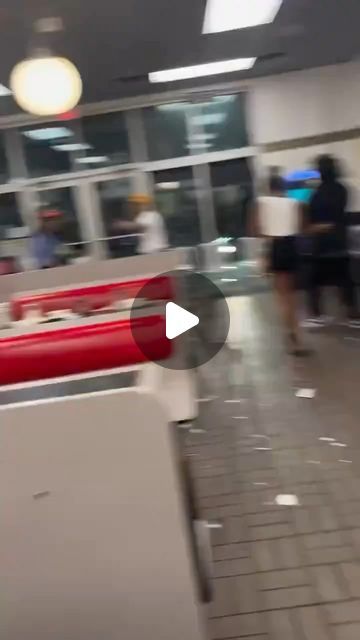 blurry image of people walking through an airport