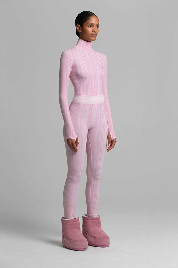 PRESALE: THIS STYLE SHIPS NOVEMBER 1 Textural vertical rib and shape wear construction complement physique while fitting flawlessly under ski suits. Top and bottom sold separately. Fitted Ribbed Elastane Activewear, Ribbed Fitted Athleisure Activewear, Fitted Elastane Activewear For Loungewear, Fitted Full Length Ribbed Activewear, Fitted High Neck Athleisure Activewear, Ribbed Fitted Bottoms For Winter, Seamless Full-length Fitted Bottoms, Sporty Ribbed Fitted Activewear, Spring High-waist Fitted Activewear