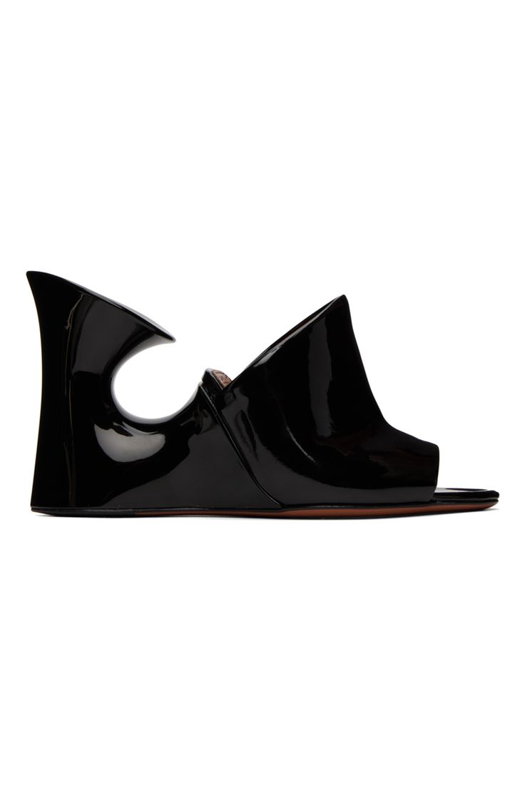 ALAÏA: Black Calfskin Sculpture Heeled Sandals | SSENSE Luxury Slip-on Heels With Sculpted Heel, Modern Evening Wedge Sandals With Sculpted Heel, Formal Slides With Sculpted High Heel, Modern Patent Leather Slip-on Heels, Modern Black Wedge Heel Mules, Evening Wedge Sandals With Sculpted Heel And Pointed Toe, Designer Slip-on Sandals With Sculpted Heel, Luxury Wedge Sandals With Deep Heel Cup, Luxury Open Toe Wedge Sandals With Sculpted Heel