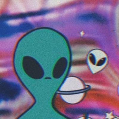 an alien is standing in the middle of a painting with other aliens around him and looking at it