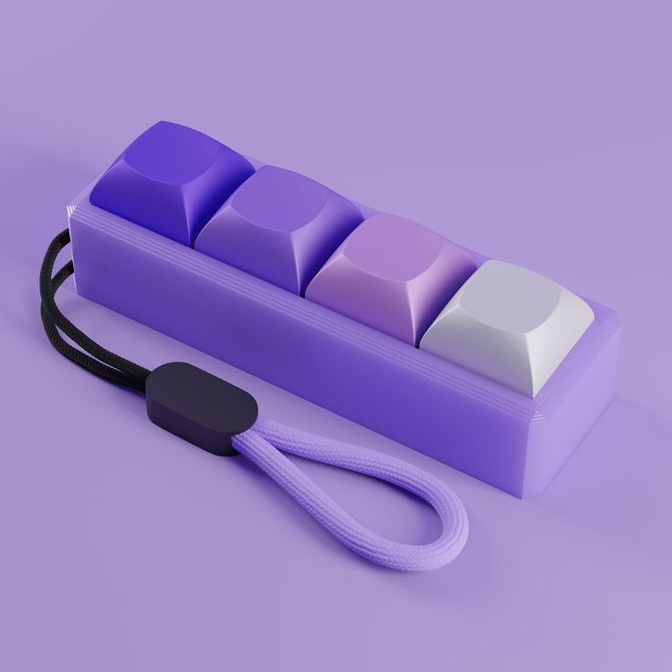 a purple and white keyboard sitting on top of a purple table next to a black cord