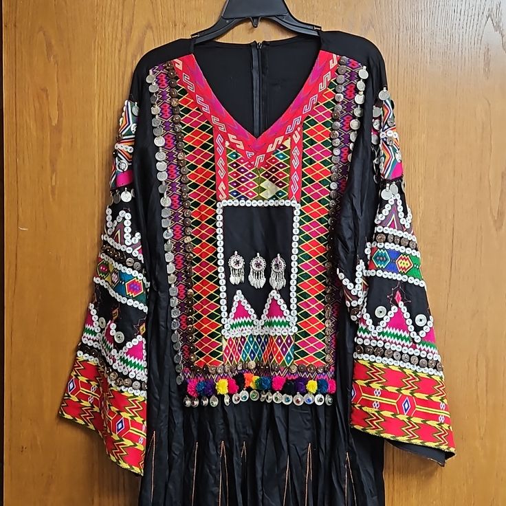 Nurstani/Khoistani Dress. Size Fits Medium. It Has A Belt That Can Be Tied In The Back. Black Kaftan With Dupatta, Silk Festival Dress With Dupatta, Festive Black Kaftan With Traditional Patterns, Traditional V-neck Dabka Dress, Bohemian Silk Dresses With Mirror Work, Black Dresses With Traditional Patterns For Eid, Eid Dresses With Traditional Black Patterns, Black Dresses With Traditional Patterns For Festive Occasions, Black Festive Dresses With Traditional Patterns