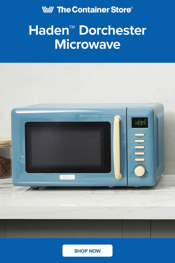 a blue microwave oven sitting on top of a counter