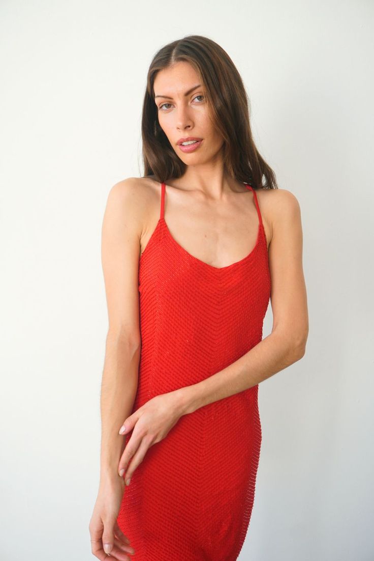 Shine on. This luxurious & stunning slip dress is mini-length and is fully hand-beaded by women artisans in Bali. Perfect for a night out or special occasion, you'll be sure to dance 'til dawn in this dress. Features adjustable back crisscross straps and an invisible back zipper. Also available in White. Ethically handcrafted from luxurious sustainable fabrics certified Oeko Tex Standard 100.1% of your order funds regenerative carbon offsets How it Fits Product Details Fabric & Care Fits true to Summer Embellished Sequin Bodycon Dress, Sleeveless Mini Dress With Beaded Straps For Evening, Summer Embellished Bodycon Sequin Dress, Party Season Dresses With Beaded Straps, Summer Sequin Dress With Beaded Straps For Night Out, Sequin Dress With Beaded Straps For Summer Night Out, Fitted Sequin Dress With Beaded Straps For Summer, Night Out Mini Dress With Beaded Spaghetti Straps, Evening Mini Dress With Beaded Spaghetti Straps