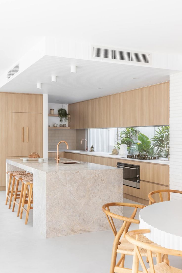 the kitchen is clean and ready to be used as a dining room or living area