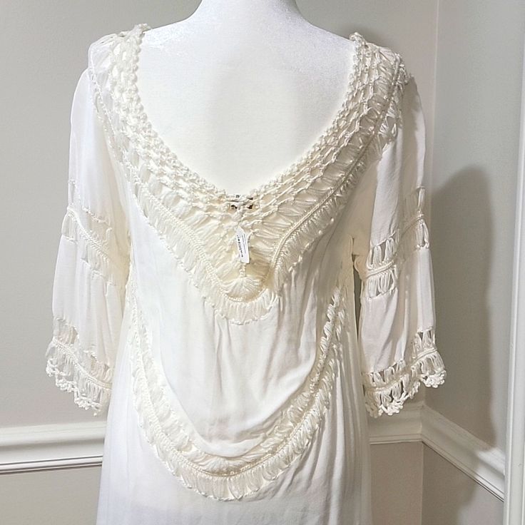 Nwt! Boutique Purchase Can Be Worn As A Swimsuit Cover Up, Tunic, Or Dress Beautiful White W/ Cream Colored Crochet Soft & Lightweight Cotton/Polyester Material Loose & Flowy Fit - Can Also Drape Off Of The Shoulders Deep V-Neck Elbow Length Bust - 36 In. Length - 37.5 In. (From Top Of Shoulder To Longest Part At Bottom) Note: One Tiny Gray Blemish At Bottom Left Hem In The Back (Not Visible Unless Dress Is Stretched Out Flat) - See Last Pic Cream V-neck Top With Crochet Trim, Elegant V-neck Lace Top For Beach, Elegant White V-neck Crochet Top, Elegant Crochet Trim Top For Beach, Festival V-neck Tops With Lace Trim, White V-neck Lace Top With Crochet Trim, White Lace Top With Crochet Trim V-neck, White Lace V-neck Crochet Top, White Lace Crochet V-neck Top