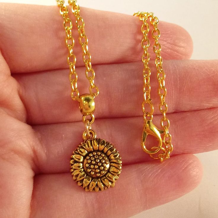 This Beautiful Sunflower Pendant Chain Necklace With Lobster Clasp Is Made Of Antique Gold Alloy. Brand New And Has Never Been Worn. Lead And Nickel Free. This Fine Quality Necklace Is Perfect For Everyday Wear Or A Special Gift. Get An $18 Gift Of Your Choice In My Listings With Purchase Of Two Or More Items. Please Send Offers And Questions. Pendant Measures: 15x28mm .59" X 1.10" With Bail Chain Measures: 20" Gold Metal Flower Necklace With Adjustable Chain, Yellow Flower Shaped Jewelry With Adjustable Chain, Adjustable Yellow Flower Charm Necklace, Yellow Chain Necklace Gift, Adjustable Yellow Flower Pendant Necklace, Yellow Adjustable Flower Pendant Necklace, Gold Metal Flower Necklace As Gift, Yellow Flower Necklaces For Jewelry Making, Dainty Yellow Flower Necklace