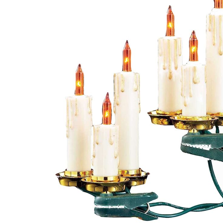 a group of candles that are sitting on some kind of stand with lights attached to them