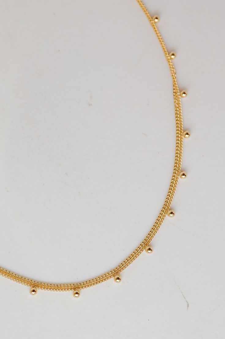 Gold Layered Chain Necklace Trendy Double Strand Gold Chain Necklace, Trendy Gold Double Chain Necklace, Gold Delicate Chain Choker Necklace, Gold Layered Chain Necklace In Choker Style, Gold Choker Layered Necklace, Trendy Gold Layered Necklace With Double Chain, Trendy Gold Layered Double Chain Necklace, Trendy Gold Jewelry With Satellite Chain, Trendy Gold Layered Chain Necklace