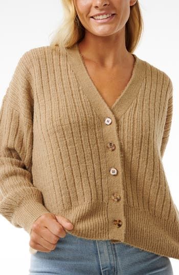 Soft ribbing adds to the coziness of this charming V-neck cardigan knit in a relaxed fit. V-neck Long sleeves 100% polyester Machine wash, line dry Imported Cozy Brown Ribbed Cardigan, Brown Ribbed V-neck Cardigan, Ribbed V-neck Brown Cardigan, Cozy Textured Knit V-neck Outerwear, Trendy Ribbed V-neck Cardigan, Beige Ribbed V-neck Outerwear, Beige V-neck Ribbed Outerwear, Beige Textured Knit V-neck Cardigan, V-neck Cardigan For Loungewear In Winter