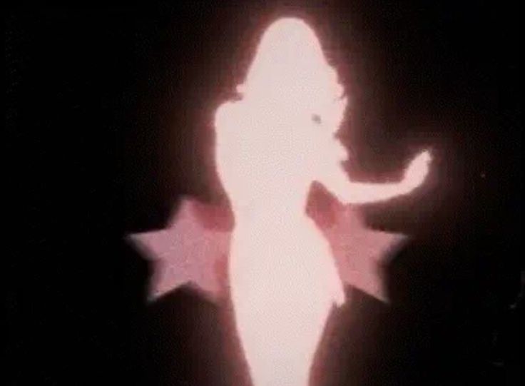 the silhouette of a woman is shown in this blurry image with stars on her body