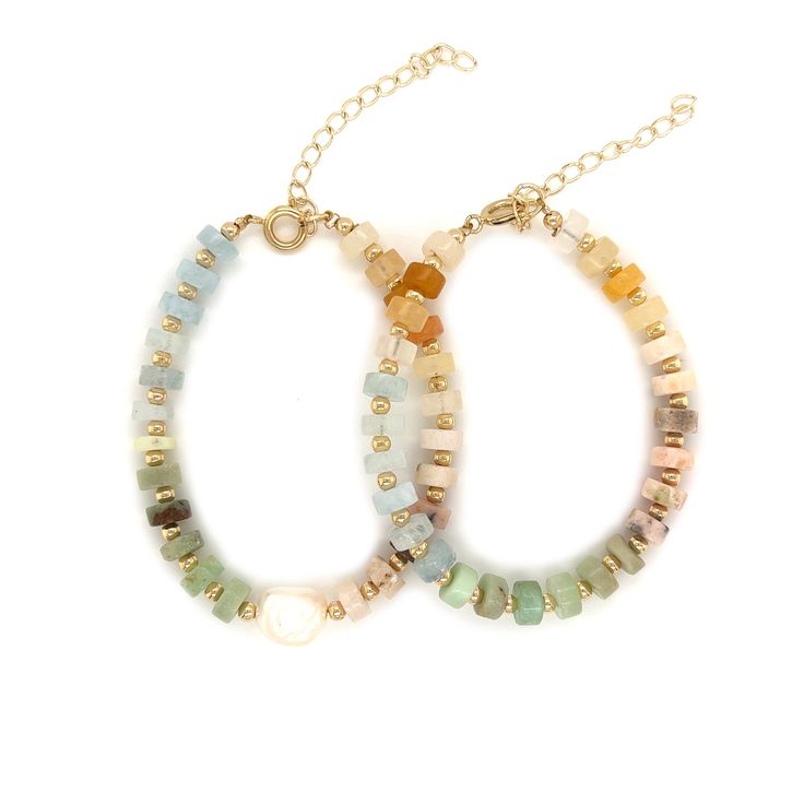 A Delicate staple to add some color to your arm candy. Ombre Natural Mixed 5mm Gemstone Beaded Bracelets with Gold Bead Accents. Gemstones in Bracelet: Pink Opal, Chrysoprase, Aquamarine, Yellow JadeBracelet length: 6" + 2" extension Handmade with Love in the USA. Packaged and ready for gifting in our MaLi jewelry pouch and box. Proper Care for your new MaLiBeads: MaLi's Gold Filled Jewelry is tarnish resistant and high in quality, however, we still recommend proper care to keep the jewels looki Dainty Adjustable Beaded Bracelets With Natural Stones, Elegant Beaded Bracelets For Healing With Colorful Beads, Elegant Beaded Pearl Bracelet For Healing, Dainty Adjustable Gemstone Beaded Bracelets, Elegant Beaded Amazonite Jewelry, Adjustable Pearl And Gemstone Beads Bracelet, Dainty Adjustable Bracelets With Natural Stones, Natural Stones Round Beads Bracelets, Minimalist Rondelle Gemstone Beaded Bracelets